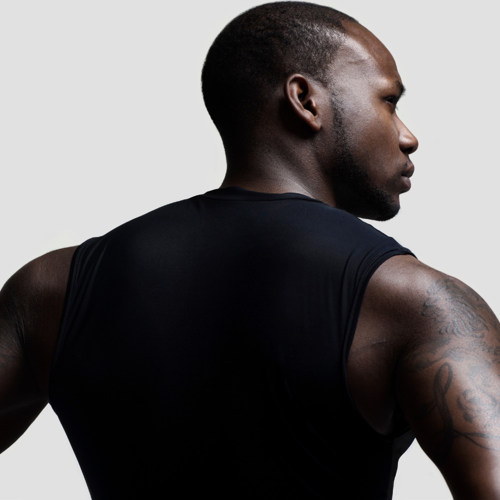 Close-up of an athlete in a black sleeveless shirt