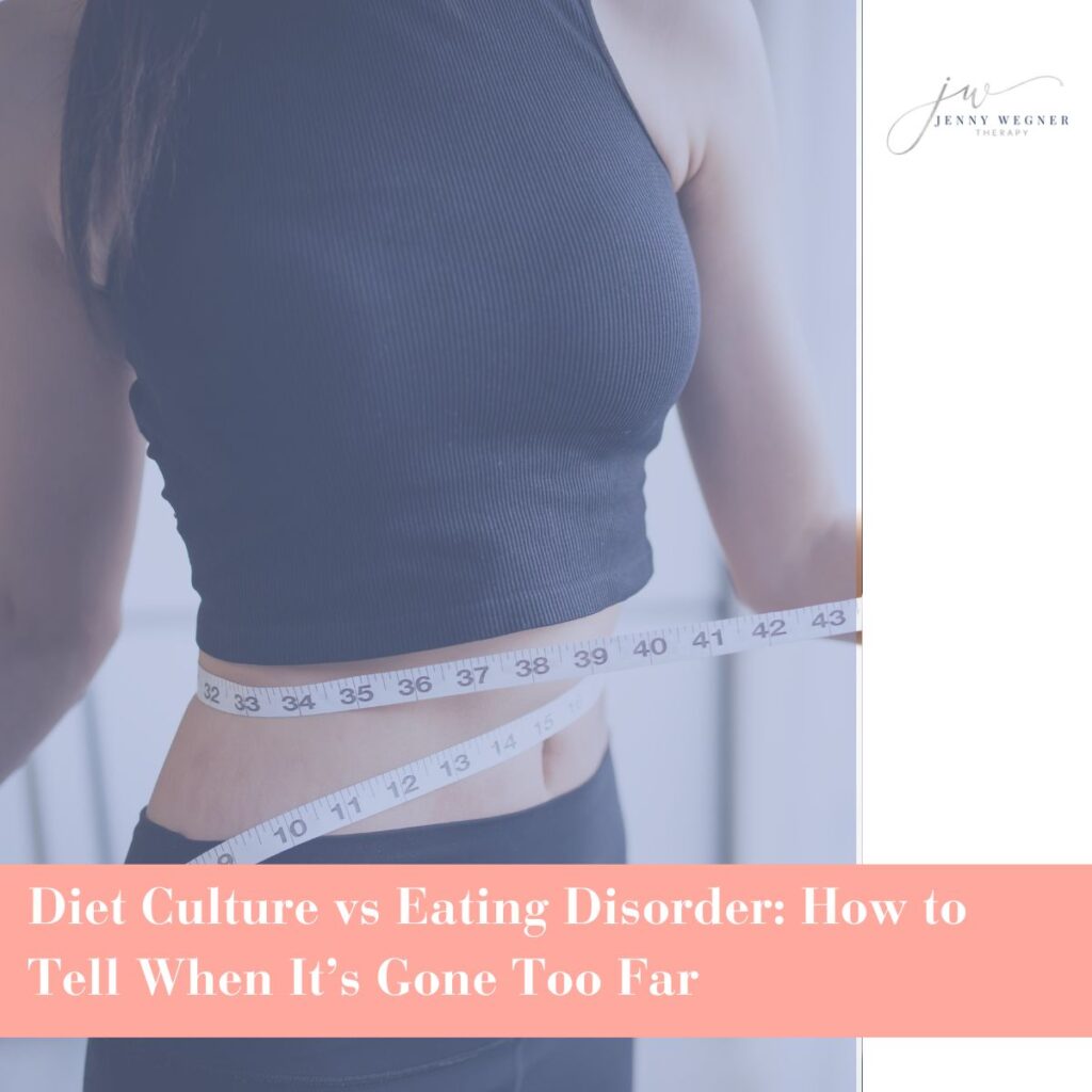Woman measuring waist with tape over black crop top