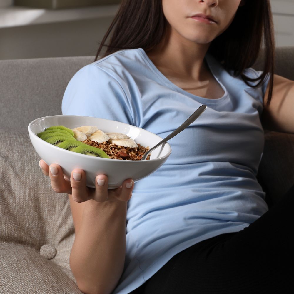 Young woman holding bowl
